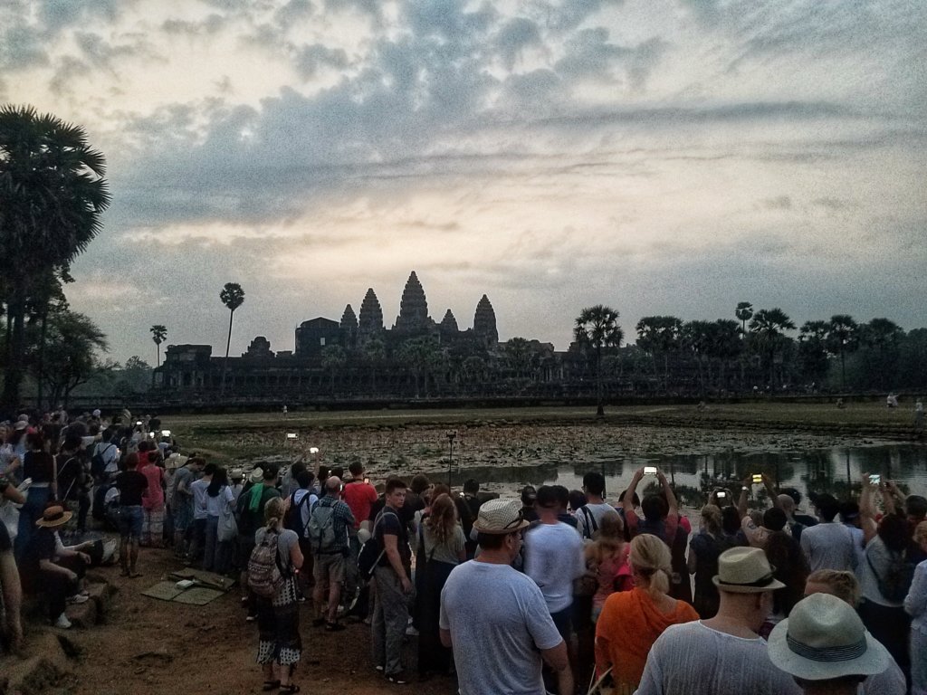 thousands of tourists waiting for sunrise at Angkor Wat