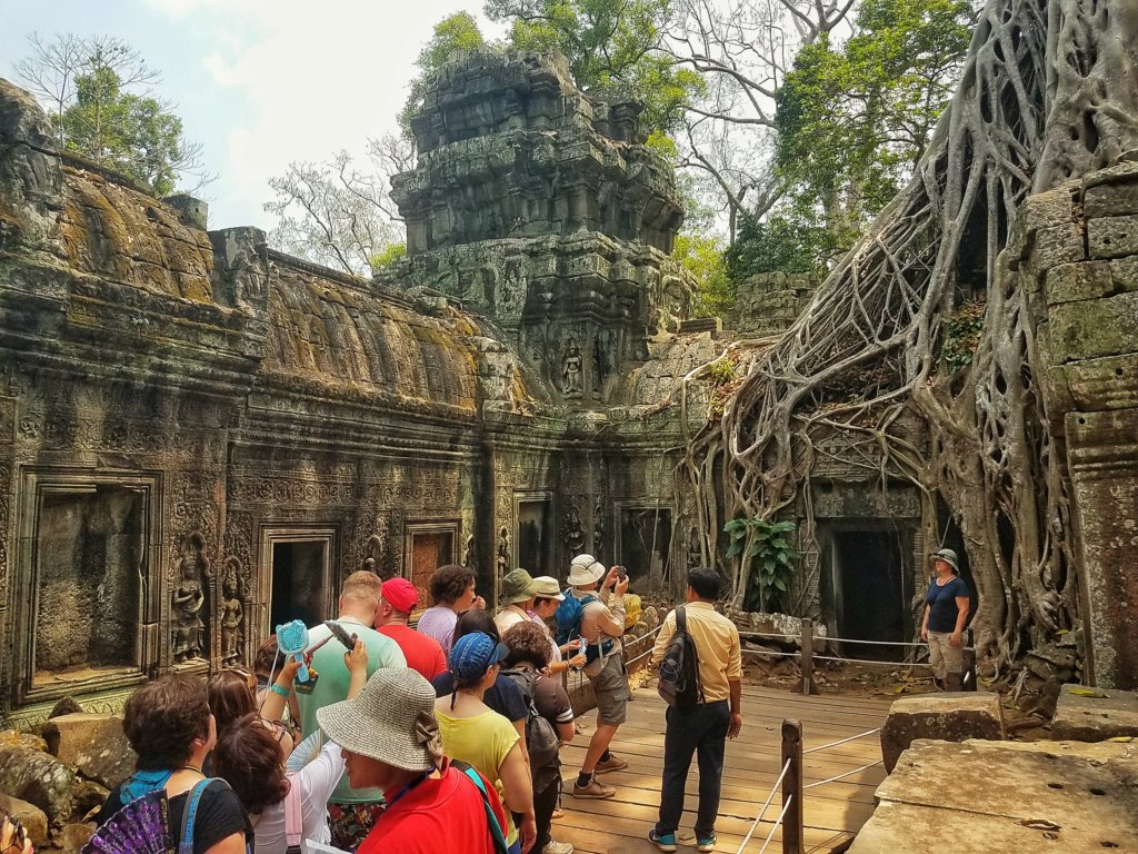 crowds of tourist waiting to take a picture at the tomb raider temple at Angkor
