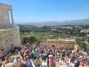 crowd of tourists in a bottleneck at Athens most popular tourist site, the Acropolis