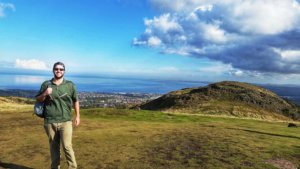 The Hangry Backpacker atop Edinburgh's most famous tourist attraction, Arthur's Seat