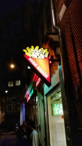 high snack sign at night in Amsterdam Red Light District