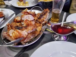 eating piri piri chicken Lisbon