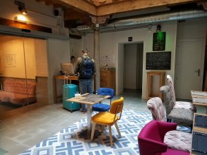 hostel guest checking in at reception desk