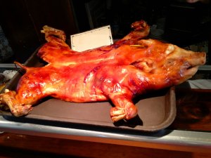 whole cochinillo asado, a roast suckling pig, famous eating in Segovia Spain