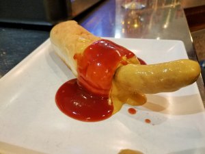 Eating a funny-looking Madrid hot dog at Galatea Cafe