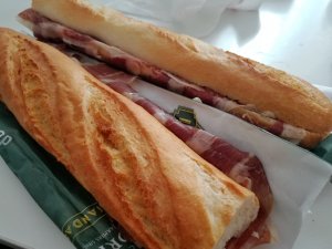 eating cheap in Madrid with two bocadillo sandwiches with jamon