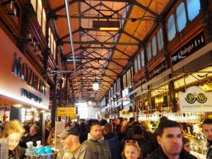 crowds of people eating at Mercado de San Miguel in Madrid Spain