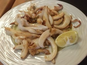 eating a plate of squid seafood in Madrid