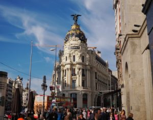 Metropolis building and crowds on Alcala Street