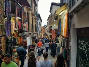 Tourist street in Granada with souvenir shops and trinkets
