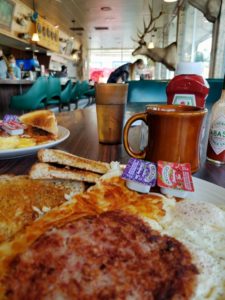 Corn beef hash with eggs, hash browns, toast and coffee in Baker City, Oregon restaurant