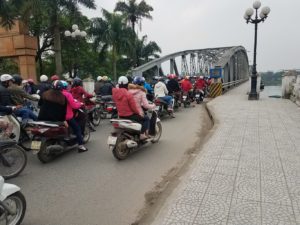 Bridge in Hue Vietnam full of motorbike traffic