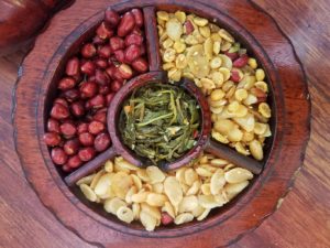 plate of various types of roasted peanuts