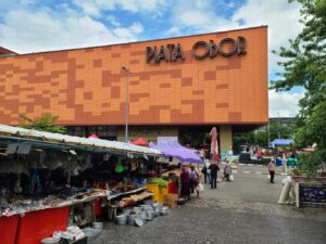 Exterior of Obor Market in Bucharest with stalls of vendors selling home good and kitchen supplies