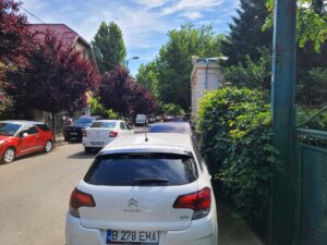 cars in Bucharest parked on the sidewalk
