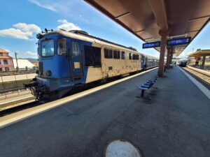 train on platform in station in Romania