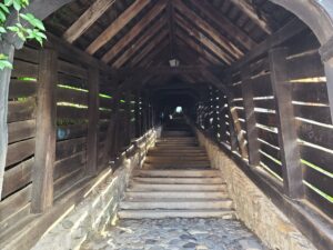 Looking up the dark and covered 176 steps of the Scholars Stairs in Sighisoara Romania