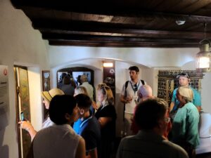 Crowded rooms of tour groups inside Bran Castle