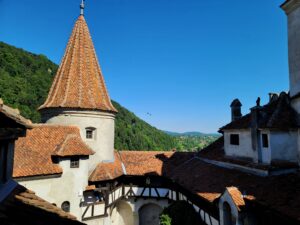 Interior Courtyard of Bran Castle with mountains in the distance
