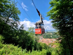 Cable Car with Coca-Cola branding going to the top of Tampa Mountain