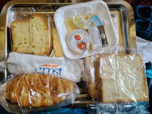breakfast of bread and cakes aboard the train in Egypt