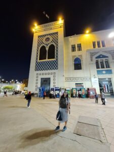 backpacker outside of Cairo train station at night