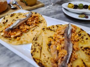 Catalan cuisine of fish on bread with olives in Barcelona