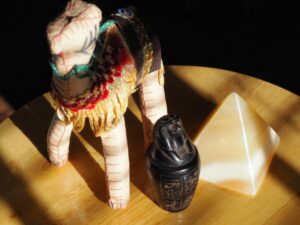 Egypt souvenirs with a stuffed camel, a pyramid and small sarcophagus 